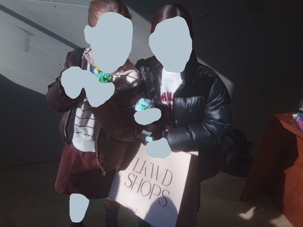 Girls holding treats and Glitter Girls swag bags
