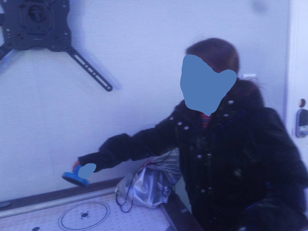 Girl playing air hockey in the game room